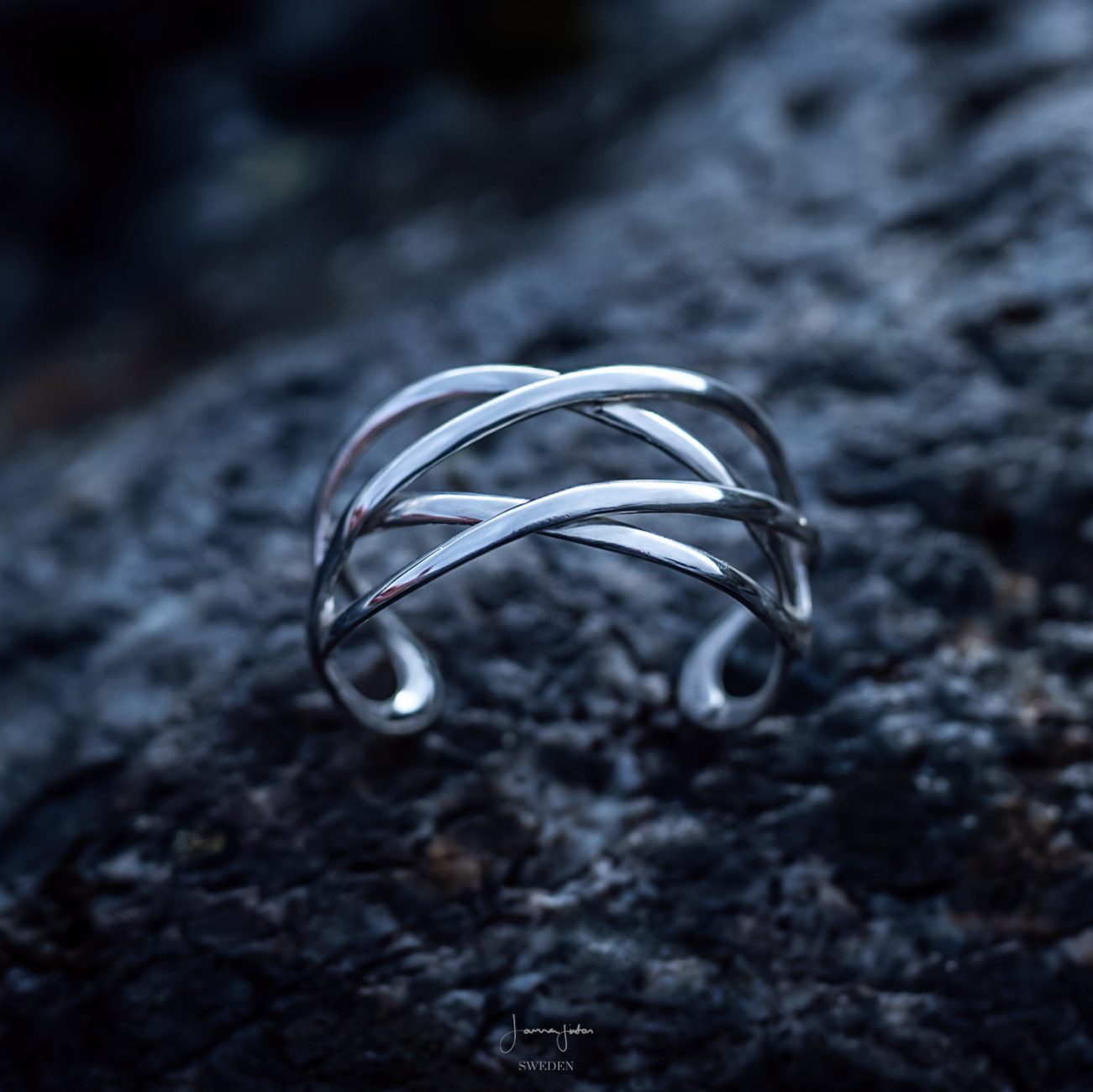 Eternity silver armcuff featuring an intricate Celtic love knot design.