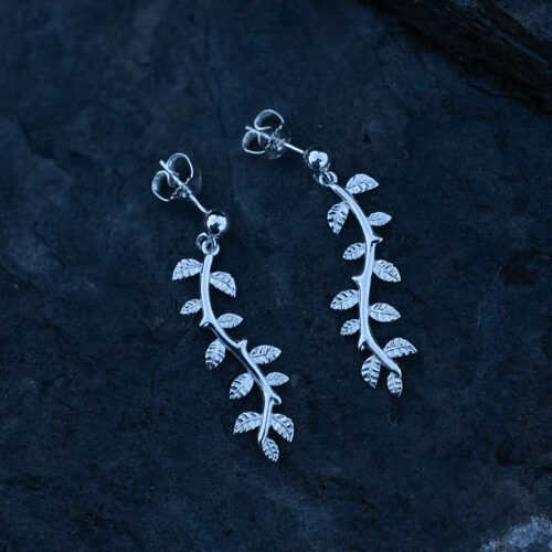 A pair of long delicate silver leaf earrings