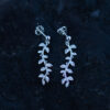 A pair of long delicate silver leaf earrings