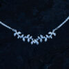 Close up of A silver leaf necklace with delicate leaf details