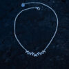 A silver leaf necklace with delicate leaf details