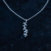 A silver leaf pendant necklace with delicate botanical details
