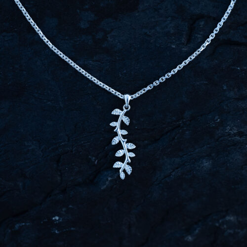 A silver leaf pendant necklace with delicate botanical details